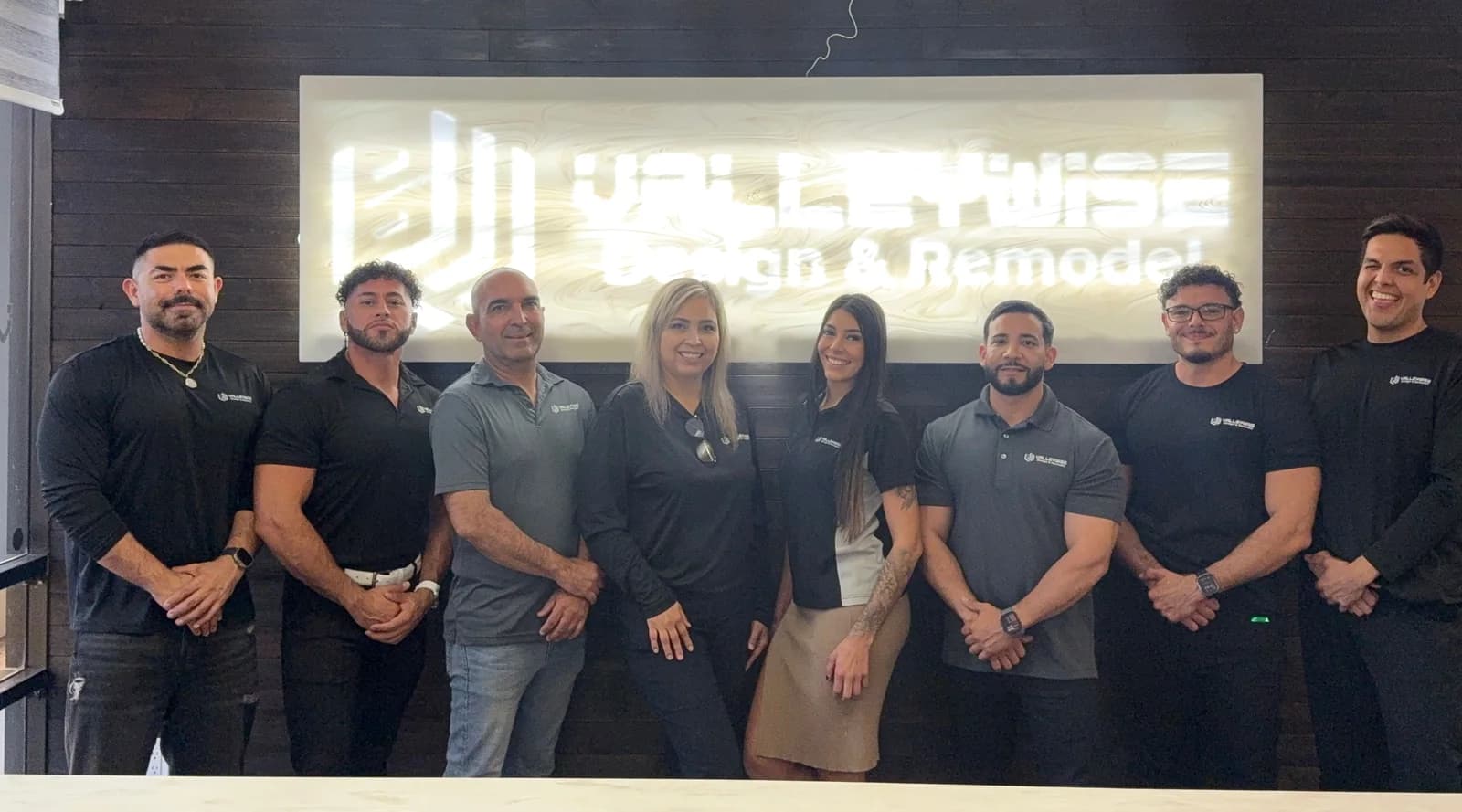 The Valleywise crew together in front of their office sign